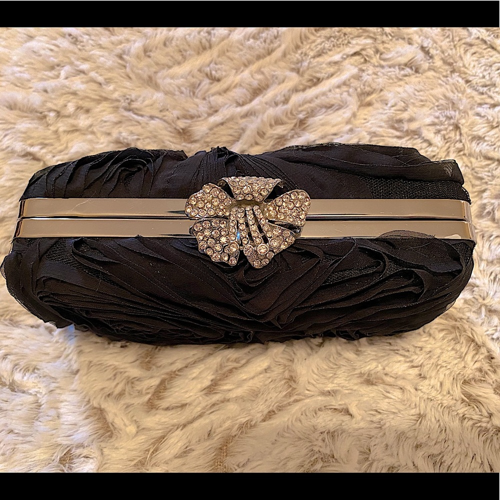 Sandra Roberts black rose clutch